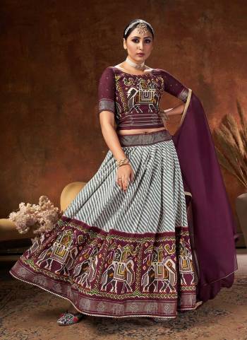 Grab These Beautiful Colored Lehenga Choli Pair With Designer Blouse And Dupatta.These Lehenga And Blouse Are Fabricated On Velvet Tussar Silk Pair With Velvet Tussar Silk Dupatta.Its Beautified With Digital Patola Printed And Swarovski Work.