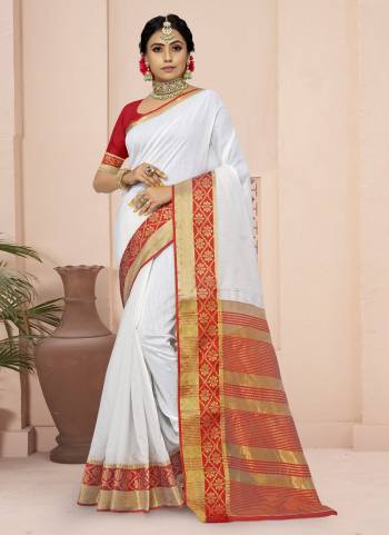 For A Different Look,Grab These White Colored Saree Pair With Red Blouse.These Saree And Blouse Are Fabricated On Cotton Blend.Its Beautified With Wevon Border Pallu Designer Work.