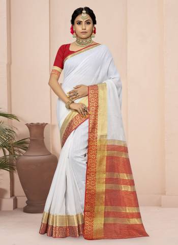 For A Different Look,Grab These White Colored Saree Pair With Red Blouse.These Saree And Blouse Are Fabricated On Cotton Blend.Its Beautified With Wevon Border Pallu Designer Work.