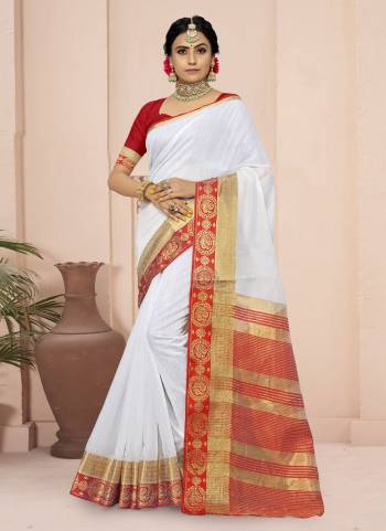 For A Different Look,Grab These White Colored Saree Pair With Red Blouse.These Saree And Blouse Are Fabricated On Cotton Blend.Its Beautified With Wevon Border Pallu Designer Work.