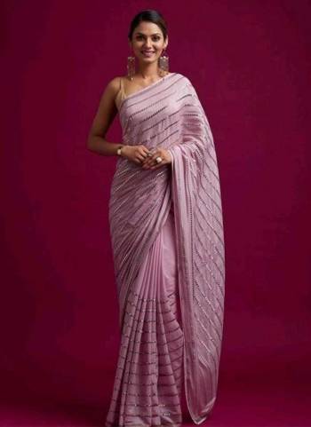 Grab These Pretty Colored Saree Pair With Matching Colored Blouse.These Saree is Fabricated On Georgette Pair With  Satin Banglori Silk Blouse.Its Beautified With Paper Mirror Embroidery Linening Work.