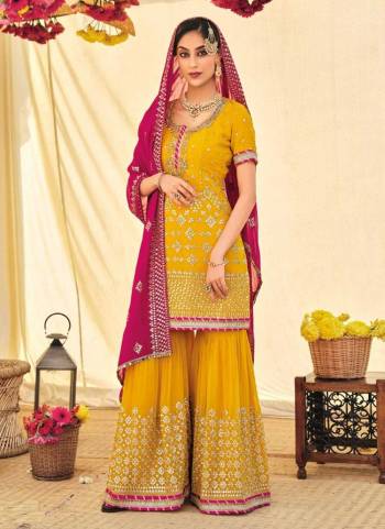 For A Designer Look,Grab These Sharara Suit in Fine Colored.These Top And Bottom Are Fabricated On Faux Georgette Pair With Soft Net Dupatta.Its Beautified With Heavy Designer Embroidery Work.