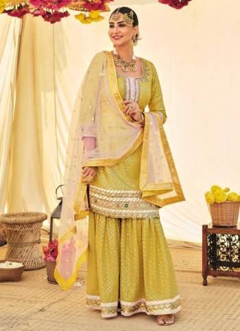 For A Designer Look,Grab These Sharara Suit in Fine Colored.These Top And Bottom Are Fabricated On Faux Georgette Pair With Soft Net Dupatta.Its Beautified With Heavy Designer Embroidery Work.