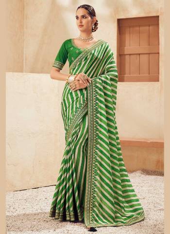 For A Beautiful Look,Grab These Fine Colored Saree Pair With Blouse.These Saree is Fabricated On Chinon  Pair With Phantom Silk Blouse.Its Beautified With Laheriya Printed And Embroidery Work.