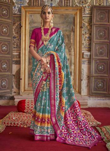 For A Designer Look,Grab These saree in Fine Colored Pair With Blouse.These Saree And Blouse Are Fabricated On  Soft Patola Silk.Its Beautified With Wevon Border Pallu,Patola Printed,Khatli Mirror Work.