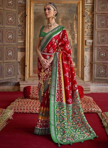 For A Designer Look,Grab These saree in Fine Colored Pair With Blouse.These Saree And Blouse Are Fabricated On  Soft Patola Silk.Its Beautified With Wevon Border Pallu,Patola Printed,Khatli Mirror Work.