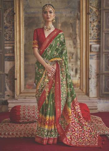 For A Designer Look,Grab These saree in Fine Colored Pair With Blouse.These Saree And Blouse Are Fabricated On  Soft Patola Silk.Its Beautified With Wevon Border Pallu,Patola Printed,Khatli Mirror Work.