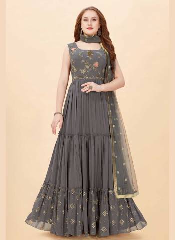 For A Designer Look,Grab These Beautiful Colored Gown Pair With Dupatta.These Gown is Fabricated On Art Silk Pair With Net Dupatta.Its Beautified With Designer Heavy Hand Embroidery Work.