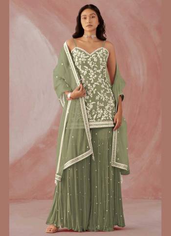 Grab These Sharara Suit in Fine Colored Pair With Bottom And Dupatta.These Top And Bottom Are Fabricated On Faux Georgette Pair With Net Dupatta.Its Beautified With Heavy Designer Embroidery Work.