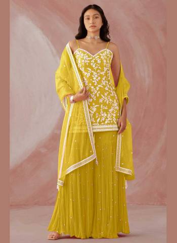 Grab These Sharara Suit in Fine Colored Pair With Bottom And Dupatta.These Top And Bottom Are Fabricated On Faux Georgette Pair With Net Dupatta.Its Beautified With Heavy Designer Embroidery Work.