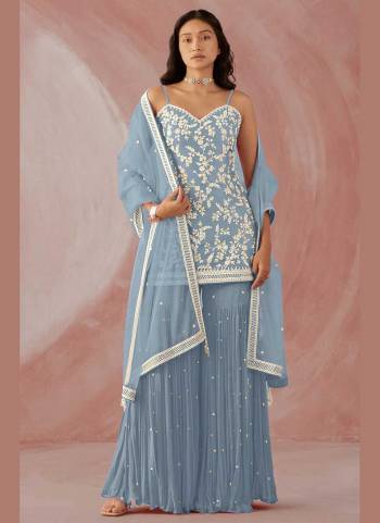 Grab These Sharara Suit in Fine Colored Pair With Bottom And Dupatta.These Top And Bottom Are Fabricated On Faux Georgette Pair With Net Dupatta.Its Beautified With Heavy Designer Embroidery Work.