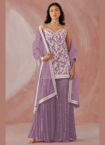 Grab These Sharara Suit in Fine Colored Pair With Bottom And Dupatta.These Top And Bottom Are Fabricated On Faux Georgette Pair With Net Dupatta.Its Beautified With Heavy Designer Embroidery Work.