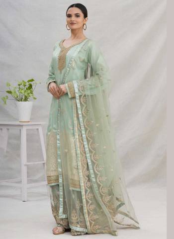 For A Designer Look,Grab These Plazzo Suit in Fine Colored Pair With Bottom And Dupatta.These Top Is Fabricated On Dolla Jacquard Pair With Net Bottom And Dupatta.Its Beautified With Wevon Designer,Embroidery,Stone Work.