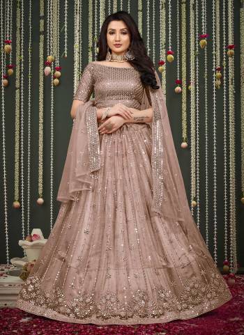 For A Different Looking Lehenga in Fine Colored Pair With Blouse And Dupatta.These Lehenga And Blouse Are Fabricated On Butterfly Net Pair With Butterfly Net Dupatta.Its Beautified With Designer Thread,Mirror Embroidery Work.