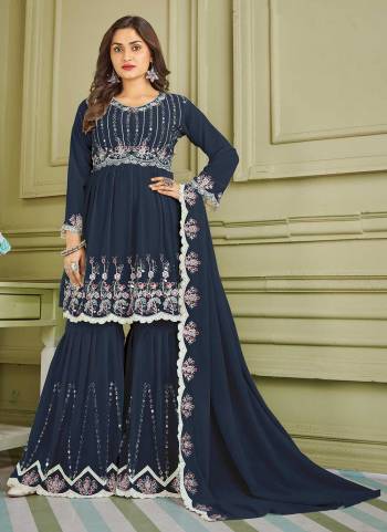 For A Beautiful Look,Grab These Sharara Suit in Fine Colored Pair With Bottom And Dupatta.These Top And Bottom Are Fabricated On Faux Georgette Pair With Faux Georgette Dupatta.Its Beautified With Designer Multy,Real Mirror Embroidery Work.