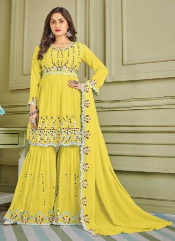 For A Beautiful Look,Grab These Sharara Suit in Fine Colored Pair With Bottom And Dupatta.These Top And Bottom Are Fabricated On Faux Georgette Pair With Faux Georgette Dupatta.Its Beautified With Designer Multy,Real Mirror Embroidery Work.