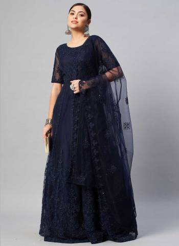 Grab These Gown in Fine Colored Pair With Dupatta.These Gown And Dupatta Are Fabricated On Net.Its Beautified With Thread Embroidery With Stone Work.