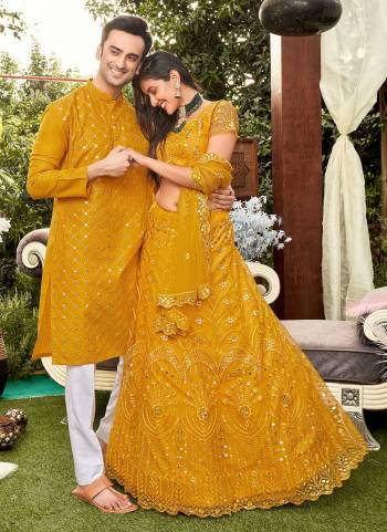 Grab These Beautiful Colored Couple Combo.These Lehenga Choli is All Over Soft Net Fabricated And PairWith Cotton Mens Wear Kurta.Its Beautified With Designer Thread,Mirror Embroidery Work. 