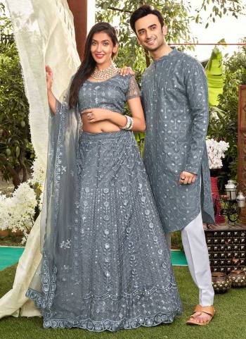 Grab These Beautiful Colored Couple Combo.These Lehenga Choli is All Over Soft Net Fabricated And PairWith Cotton Mens Wear Kurta.Its Beautified With Designer Thread,Mirror Embroidery Work. 