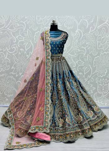 Grab These Designer Lehenga Choli in Fine Colored Pair With Blouse And Dupatta.These Blouse And Lehenga Are Fabricated On Velvet Pair With Soft Net Dupatta.Its Beautified With Heavy Dori,Thread,Jari Embroidery,Diamond Work.