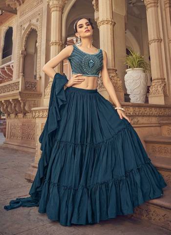 Grab These Beautiful Colored Lehenga Choli in Fine Colored Pair With Blouse And Dupatta.These Lehenga And Dupatta Are Fabricated On Chinon Pair With Art Silk.Its Beautified With Designer Thread,Mirror Embroidery Work.