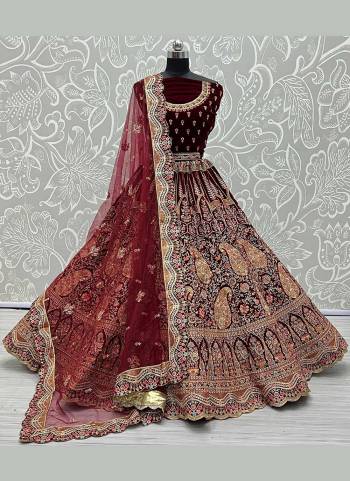 For A Bridal Look,Grab These Heavy Designer Lehenga Choli in Fine Colored.These Lehenga And Blouse Are Fabricated On Velvet Pair With Soft Net Dupatta.Its Beautified With  Patch,Multy Thread,Jari,Dori Embroidery,Diamond Work.