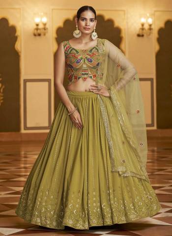 Grab These Beautiful Colored Lehenga Choli.These Leheng and Blouse Are Fabricated On Georgette Pair With Net Dupatta.Its Beautified With Heavy Thread,Sequance Embroidery Work.