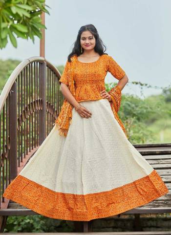 For A Different Look,Grab These Readymade Lehenga Choli in Fine Colored.These Lehenga And Blouse Are Fabricated On Cotton Satin Pair With Muslin Dupatta.Its Beautified WIth Bandhej Printed Designer Work.