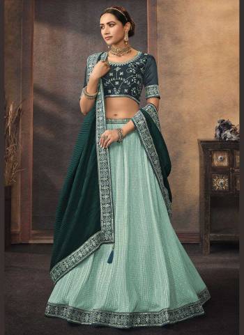 For A Designer Look,GrabThese Lehenga Choli in Fine Colored.These Lehenga And Dupatta Are Fabricated On Chinon Pair With Phantom Silk Blouse.Its Beautified With  Printed,Resham,Jari,Mirror,Sequance Embroidery Work.