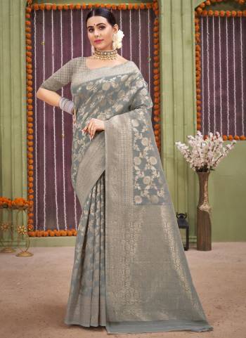 Grab These Saree in Fine Colored Pair With Blouse.These Saree And Blouse Are Fabricated On Linen.Its Beautified With Heavy Wevon Designer Work.