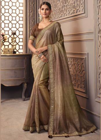 For A Designer Look,Grab These Saree in Fine Colored Pair With Blouse.These Saree is Fabricated On Viscose with golden smoke Pair With Cotton Silk Blouse.Its Beautified With Designer Work.