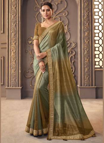 For A Designer Look,Grab These Saree in Fine Colored Pair With Blouse.These Saree is Fabricated On Viscose with golden smoke Pair With Cotton Silk Blouse.Its Beautified With Designer Work.