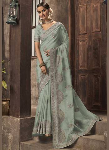 For A Different Look,Grab These Fine Colored Saree.These Saree is Fabricated On Organza Pair With Phantom Silk Blouse.Its Beautified With Jari Embroidery,Swaroski Work. 