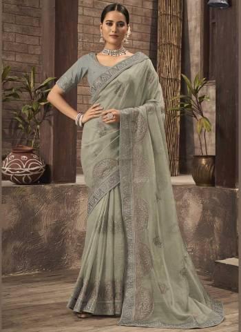 For A Different Look,Grab These Fine Colored Saree.These Saree is Fabricated On Organza Pair With Phantom Silk Blouse.Its Beautified With Jari Embroidery,Swaroski Work. 