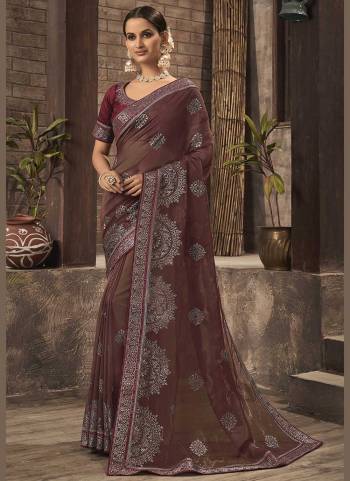 For A Different Look,Grab These Fine Colored Saree.These Saree is Fabricated On Organza Pair With Phantom Silk Blouse.Its Beautified With Jari Embroidery,Swaroski Work. 