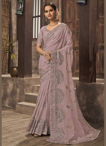 For A Different Look,Grab These Fine Colored Saree.These Saree is Fabricated On Organza Pair With Phantom Silk Blouse.Its Beautified With Jari Embroidery,Swaroski Work. 