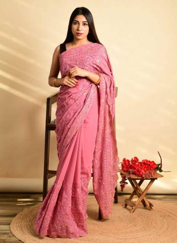 Grab These Different Looking Saree in Fine Colored.These Saree is Fabricated On Georgette Pair With Satin Banglori Blouse.Its Beautified With Sequance Embroidery Work.