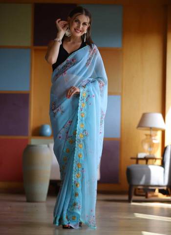 Bold And Beautiful Looking Saree in Fine Colored.These Saree is Fabricated On Georgette Pair With Satin Banglori Blouse.Its Beautified With Floral Printed,Embroidery Hand Work.