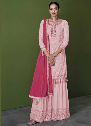 For A Designer Look,Grab These Sharara Suit in Fine Colored.These Top And Bottom Are Fabricated On Faux Georgette Pair With Faux Georgette Dupatta.Its Beautified With Heavy Thread,Mirror Embroidery Work.