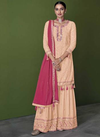 For A Designer Look,Grab These Sharara Suit in Fine Colored.These Top And Bottom Are Fabricated On Faux Georgette Pair With Faux Georgette Dupatta.Its Beautified With Heavy Thread,Mirror Embroidery Work.