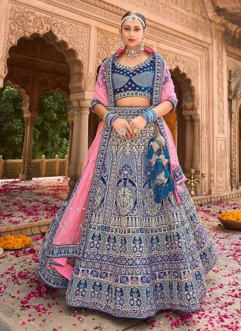 For A Designer Look,Grab These Lehenga in Fine Colored Pair With Blouse And Designer Dupatta.These Blouse And Lehenga Are Fabricated On Velvet Pair With Soft Net Dupatta.Its Beautified With Heavy Designer Embroidery,Hand Work.