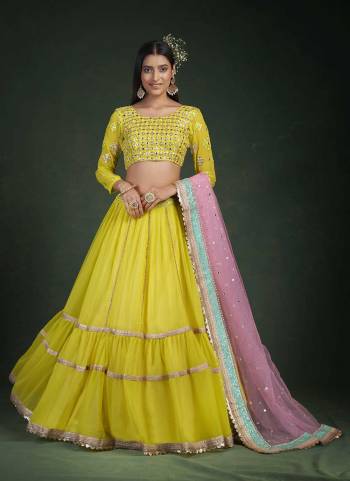 For A Designer Look,Grab These Lehenga Choli in Fine Colored.These Lehenga And Blouse Are Fabricated On Georgette Pair With Soft Net Dupatta.Its Beautified With Jari,Thread Embroidery Work.