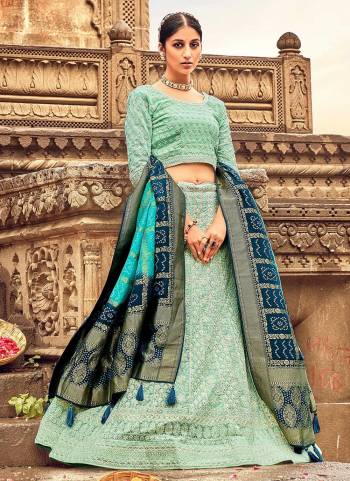 For A Designer Look,Grab These Lehenga Choli in Fine Colored.These Lehenga And Blouse Are Fabricated On Georgette Pair With Dolla Silk Dupatta.Its Beautified With Heavy Lakhnovi Embroidery Work With Wevon Designer Dupstta.