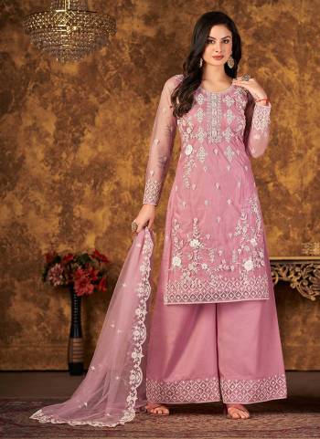 Grab These Suit in Fine Colored Pair With Bottom And Dupatta.These Top And Dupatta Are Fabricated On Net Pair With Santoon Bottom.Its Beautified With Santoon Bottom.Its Beautified With Heavy Designer Codding Embroidery,Stone Work.