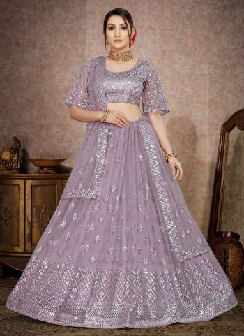 For A Designer Look,Grab These Lehenga Choli in Fine Colored.These Lehenga And Blouse Are Fabricated On Butterfly Net Pair With Butterfly Net Dupatta.Its Beautified With Designer Thread,Mirror Embroidery Work.