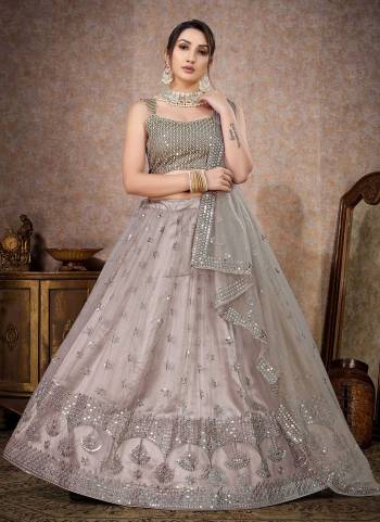 For A Designer Look,Grab These Lehenga Choli in Fine Colored.These Lehenga And Blouse Are Fabricated On Butterfly Net Pair With Butterfly Net Dupatta.Its Beautified With Designer Thread,Mirror Embroidery Work.