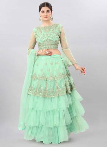 For A Designer Look,Grab These Lehenga Choli in Fine Colored.These Lehenga And Blouse Are Fabricated On Net Pair With Net Dupatta.Its Beautified With Jari,Embroidery Work.