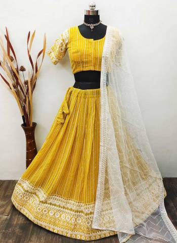 Garb These Ready To Wear Lahenga Choli In Light Color.These Lehenga And Choli Are Georgette And Organza  Fabricted Dupatta  With Lakhnovi Embroidery Work.