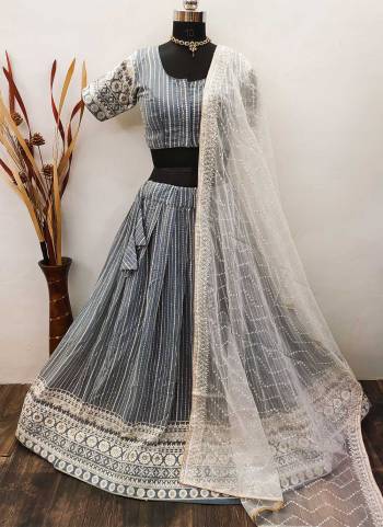 Garb These Ready To Wear Lahenga Choli In Light Color.These Lehenga And Choli Are Georgette And Organza  Fabricted Dupatta  With Lakhnovi Embroidery Work.