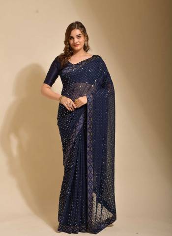 Grab These Saree in Fine Colored pair With Blouse.These Saree is Fabricated On Georgette Pair With  Satin Banglori Silk Blouse.Its Beautified With Chokdi Sequance Embroidery Work,Swarovski Border Work.